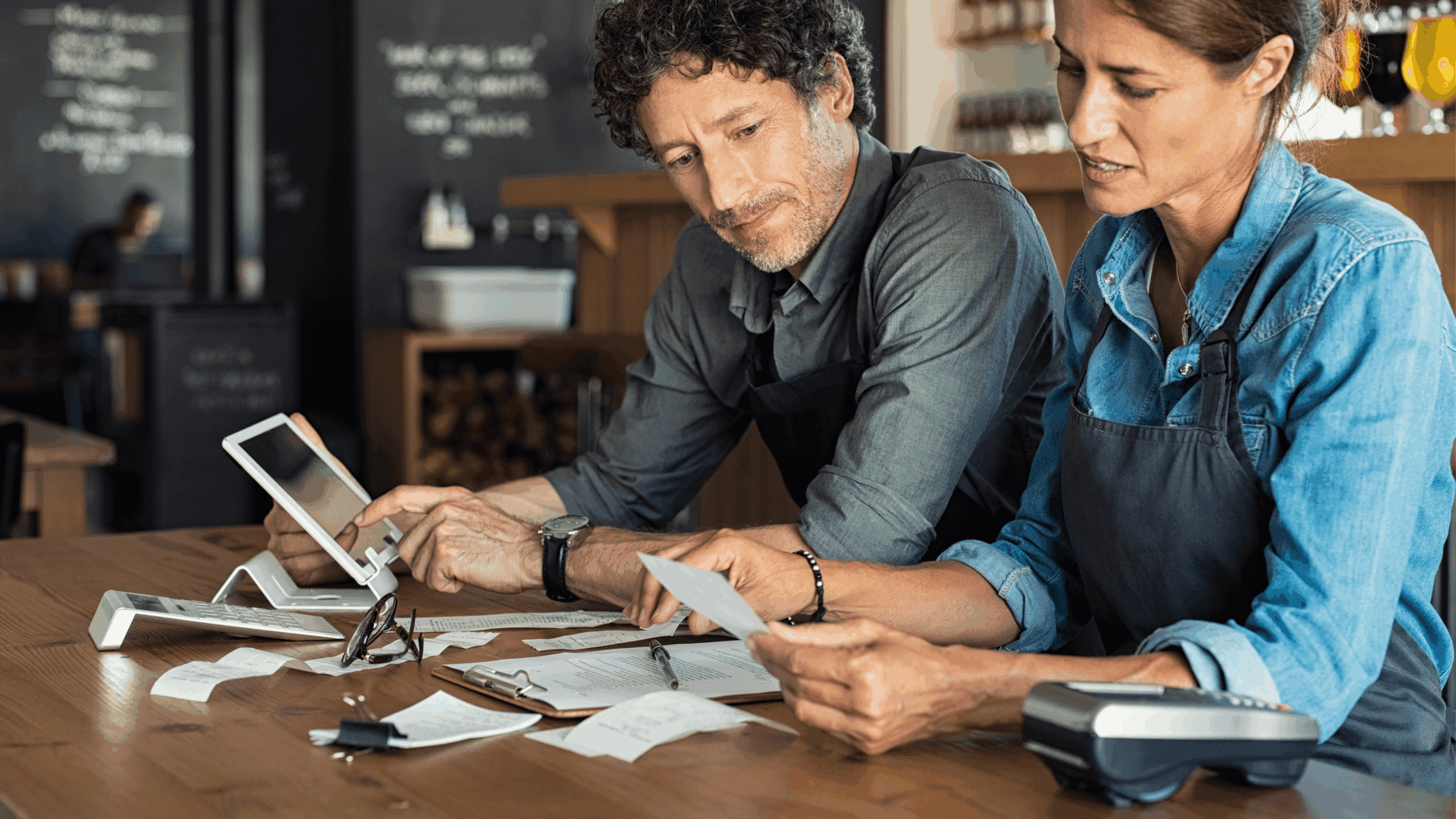 Restaurant operators reading bills